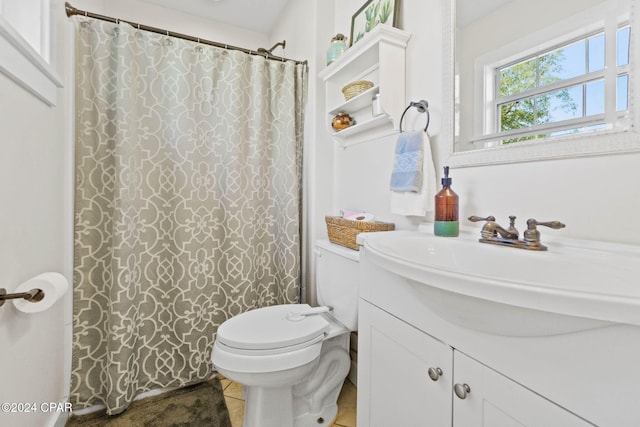 bathroom featuring tile patterned floors, vanity, a shower with shower curtain, and toilet