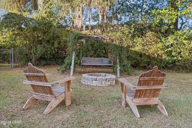 view of yard with a fire pit