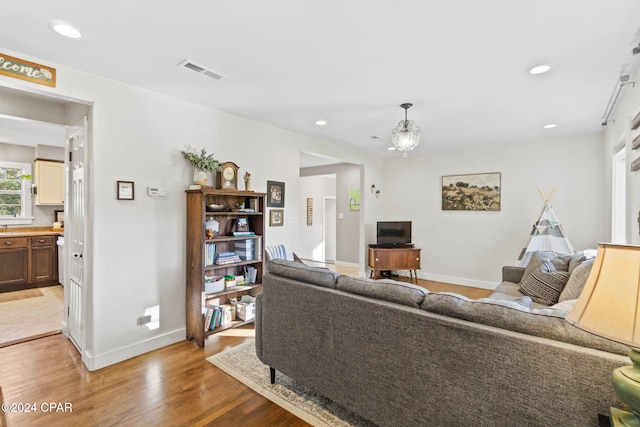 living room with light hardwood / wood-style flooring