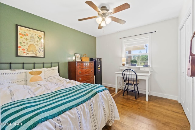 bedroom with wood-type flooring and ceiling fan