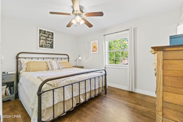 bedroom featuring dark hardwood / wood-style flooring and ceiling fan