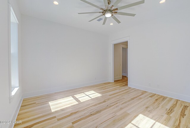 unfurnished room featuring ceiling fan and light hardwood / wood-style floors