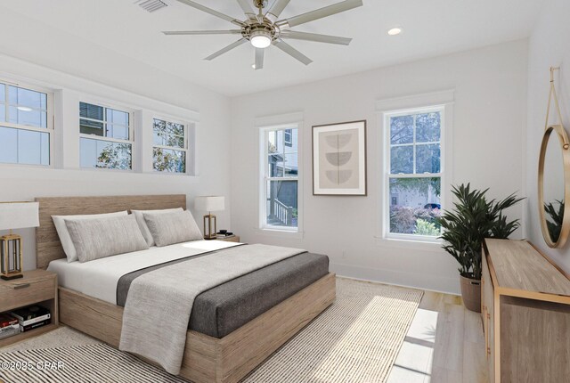 interior space featuring wood walls, light hardwood / wood-style floors, and an inviting chandelier