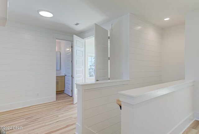 bathroom featuring toilet and a shower with shower door