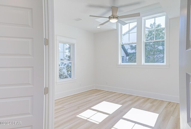 unfurnished bedroom featuring ceiling fan, a closet, and light hardwood / wood-style flooring