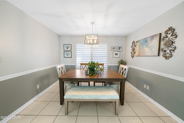 dining space featuring light tile patterned flooring