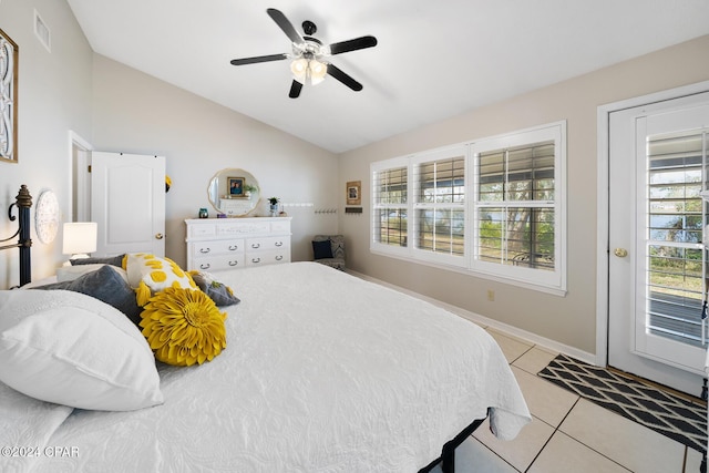 bedroom featuring ceiling fan, light tile patterned floors, access to outside, and lofted ceiling