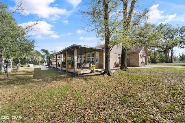 view of front of home with a front lawn and a garage