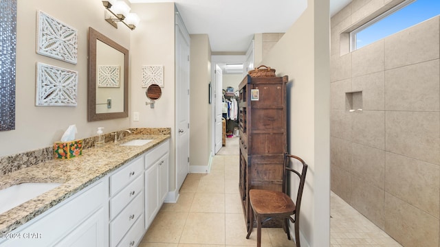 bathroom with tile patterned flooring and vanity