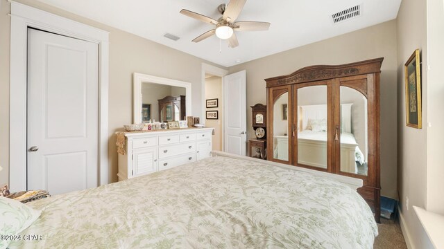 carpeted bedroom featuring ceiling fan