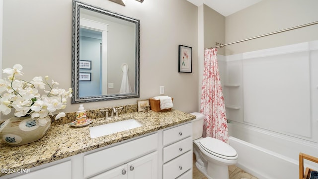 full bath featuring shower / bath combo, vanity, and toilet