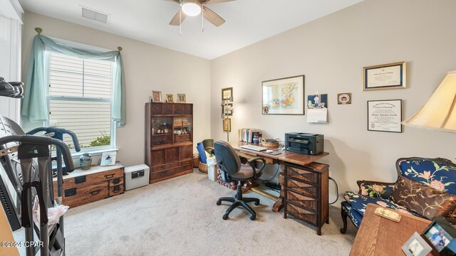 office space with ceiling fan and light colored carpet