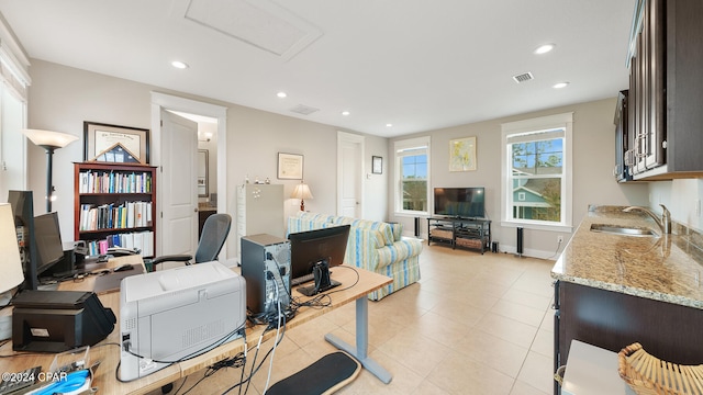 office area with sink and light tile patterned floors