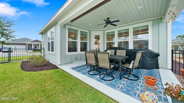 view of patio with ceiling fan and a grill