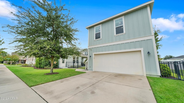 view of front of home with a garage, fence, concrete driveway, board and batten siding, and a front yard