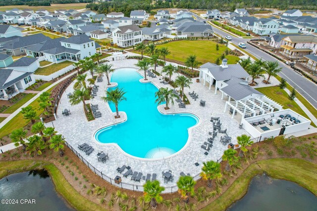 bird's eye view featuring a water view and a residential view