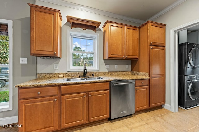 kitchen featuring dishwasher, stacked washer and clothes dryer, sink, ornamental molding, and light stone counters