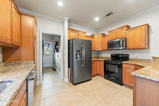 kitchen with light stone countertops, ornamental molding, and appliances with stainless steel finishes