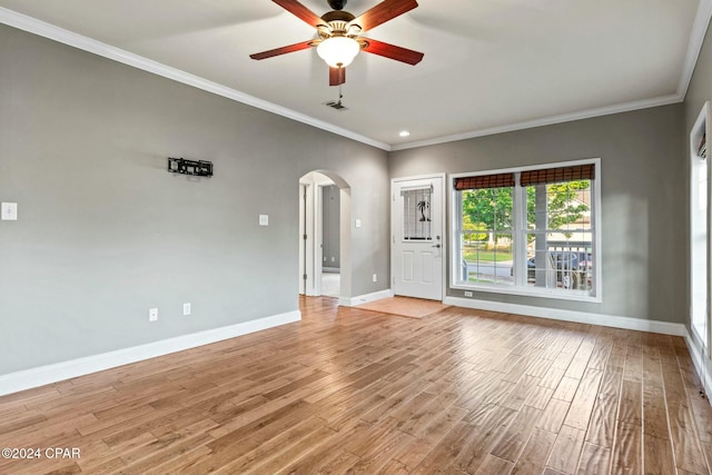 unfurnished living room with light wood-type flooring, ceiling fan, and ornamental molding