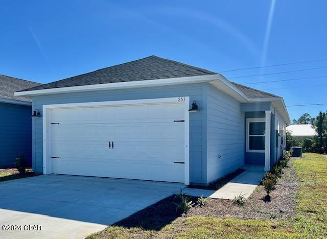 view of side of home with a garage