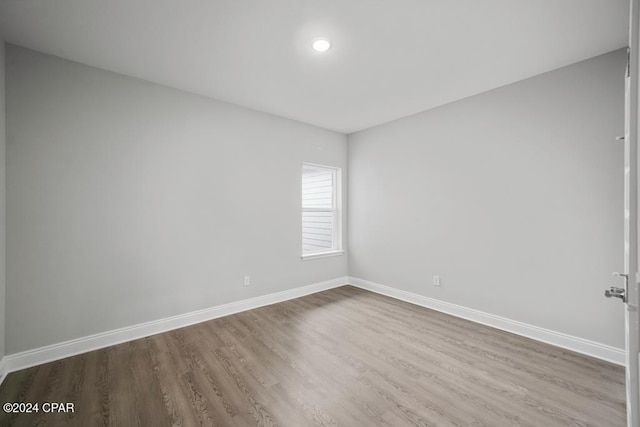 unfurnished room featuring hardwood / wood-style floors