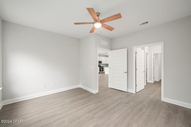 unfurnished bedroom with hardwood / wood-style floors and ceiling fan