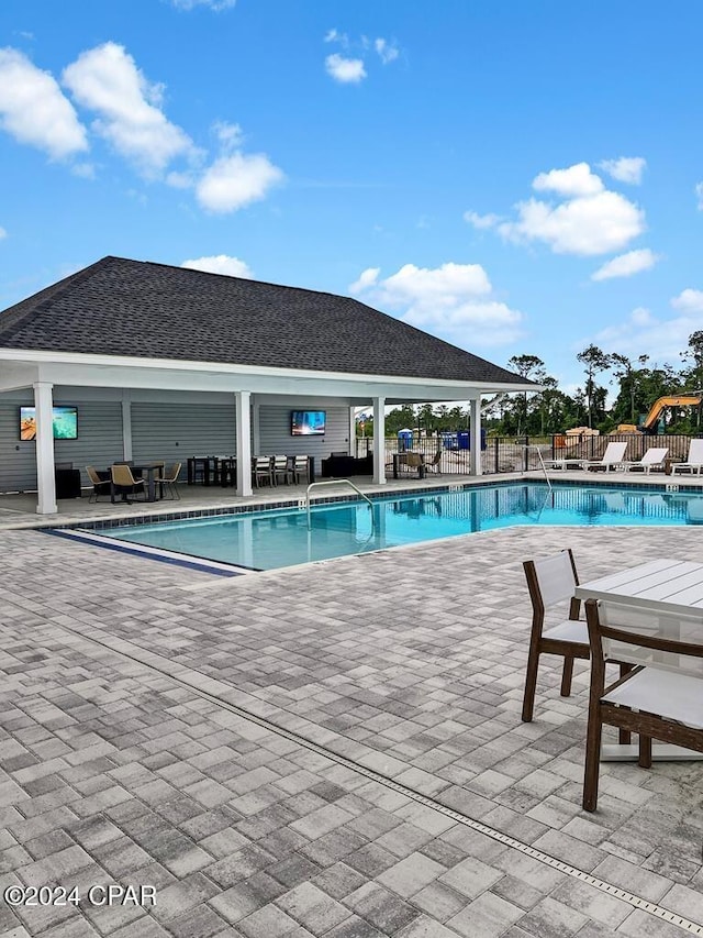 view of swimming pool with a gazebo and a patio