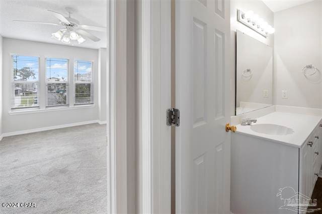 bathroom featuring vanity and ceiling fan