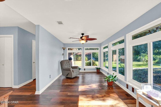 sunroom / solarium featuring visible vents and a ceiling fan