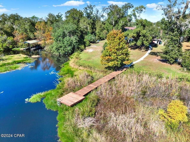 birds eye view of property featuring a water view