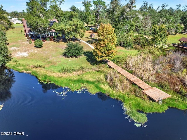 birds eye view of property featuring a water view