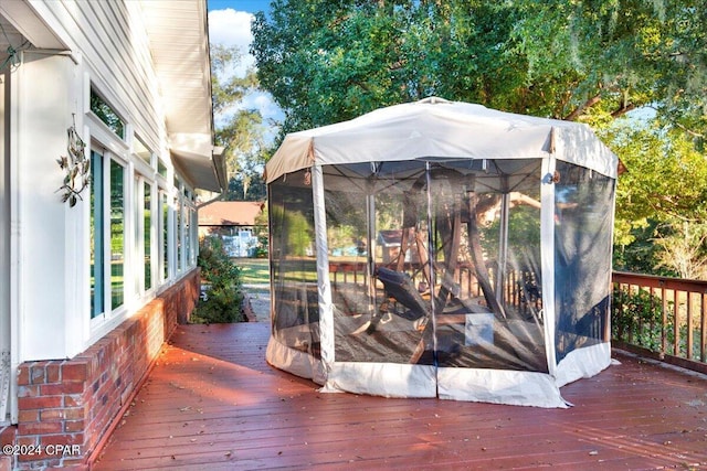 deck with a sunroom