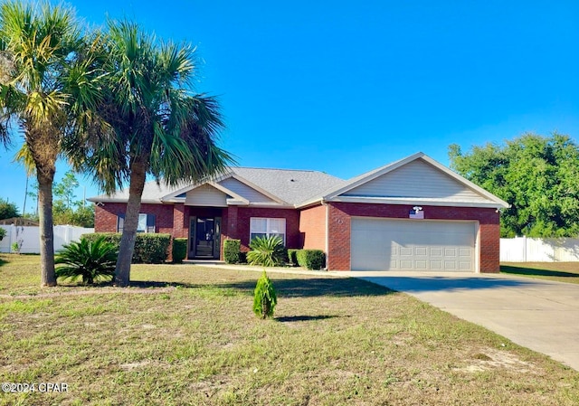 ranch-style house featuring a garage and a front lawn