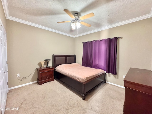 bedroom featuring a textured ceiling, ceiling fan, ornamental molding, and light carpet