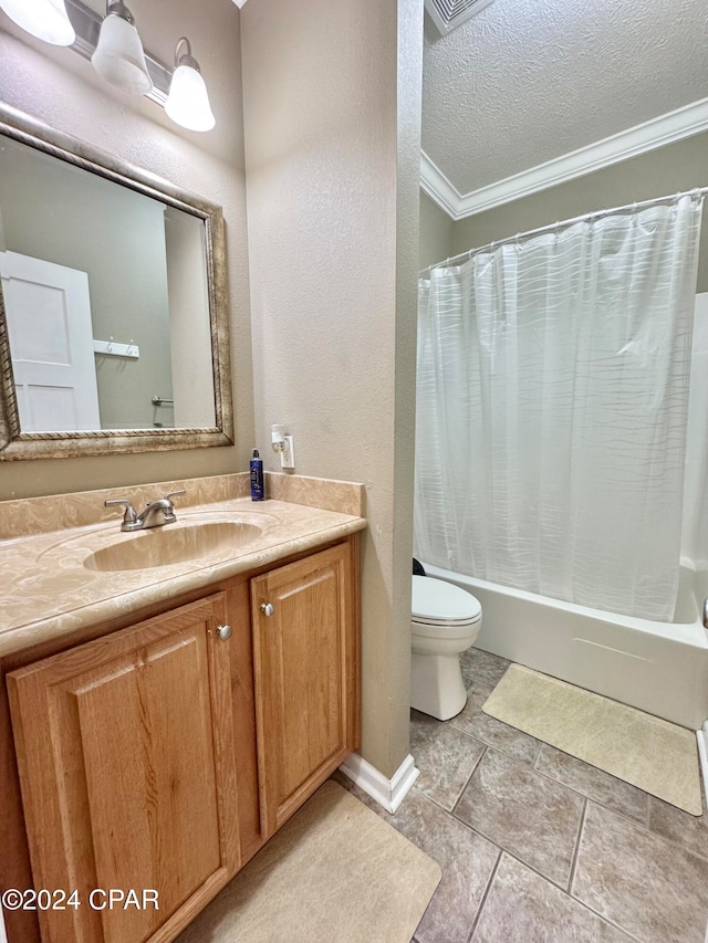 full bathroom with vanity, shower / bath combination with curtain, crown molding, toilet, and a textured ceiling