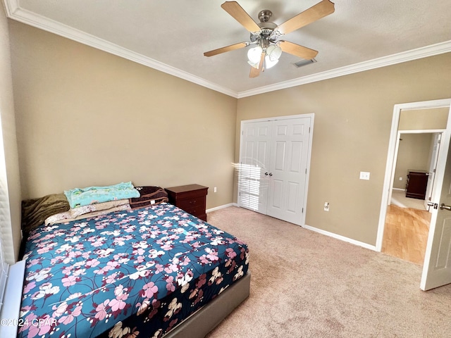 bedroom with ceiling fan, light carpet, and ornamental molding