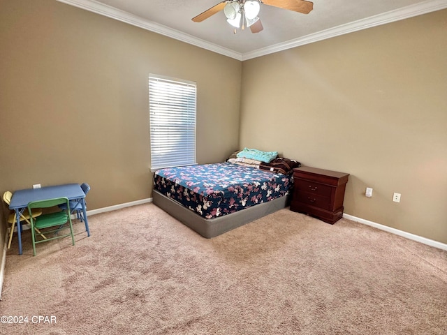 carpeted bedroom with ceiling fan and ornamental molding