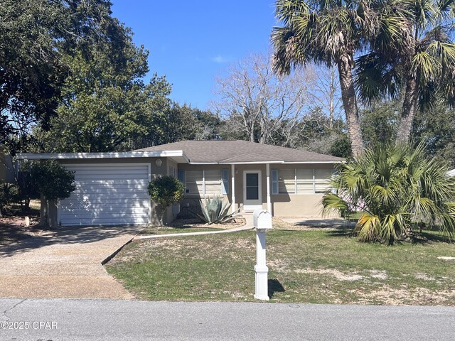 view of front facade featuring a front lawn and central AC