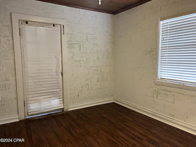 spare room featuring dark hardwood / wood-style floors