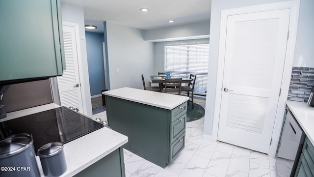 kitchen with a kitchen island and green cabinetry