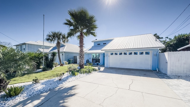 view of front of house with a front yard and a garage