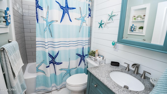 full bathroom featuring vanity, wood walls, toilet, and shower / bathtub combination with curtain