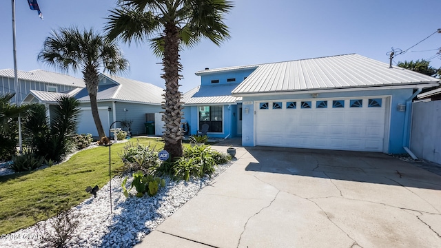 view of front facade with a front yard and a garage