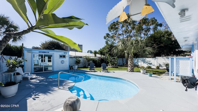 view of swimming pool with a patio area