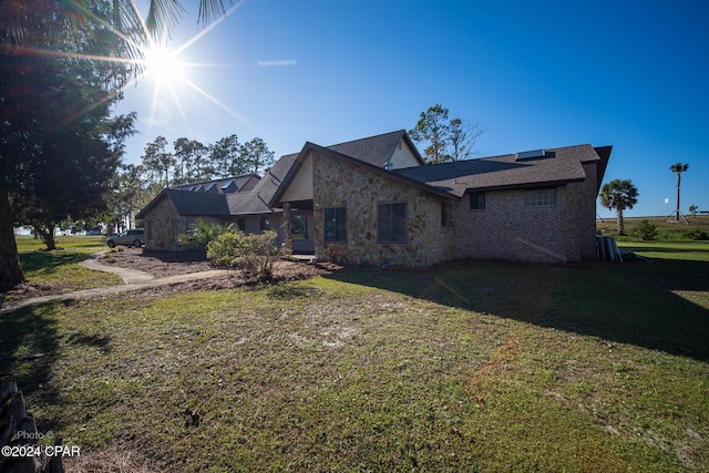 view of home's exterior featuring a yard