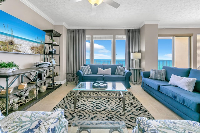 tiled living room featuring crown molding, a water view, a textured ceiling, and ceiling fan