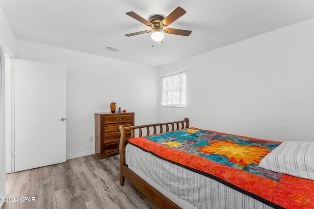 bedroom featuring ceiling fan and wood-type flooring