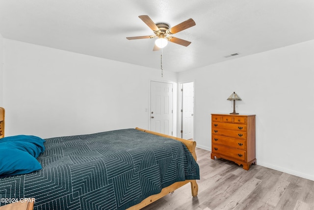bedroom with ceiling fan and light wood-type flooring
