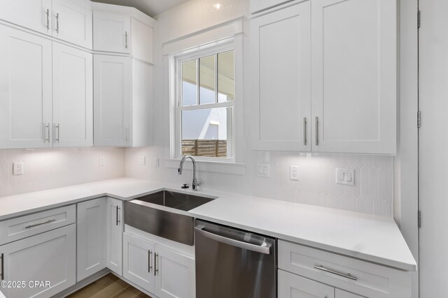 laundry room with cabinets, dark hardwood / wood-style floors, hookup for a washing machine, and electric dryer hookup