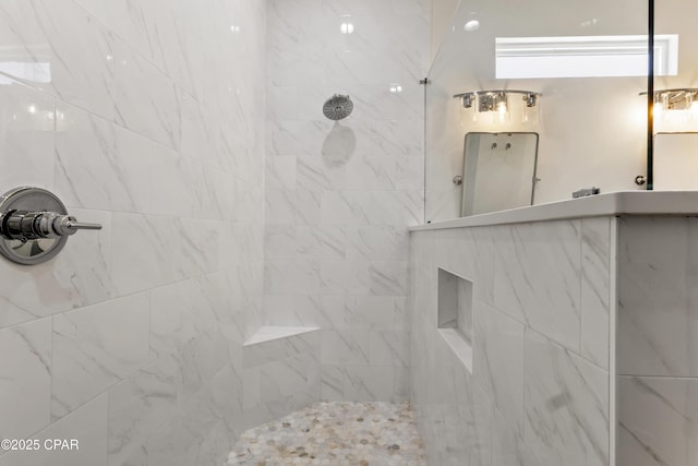 full bathroom featuring a tile shower